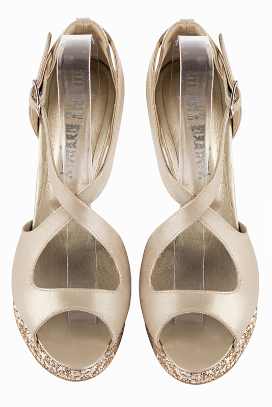 Gold women's closed back sandals, with crossed straps. Round toe. Very high slim heel with a platform at the front. Top view - Florence KOOIJMAN